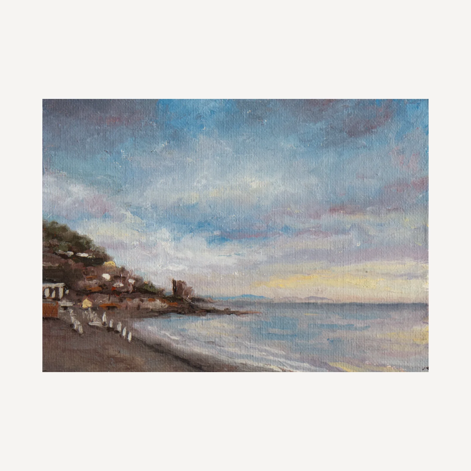 Colourful painting of the coast line of Amalfi, showin gthe beach curving round to a jetty, the sea and lots of blue sky with colourful clouds